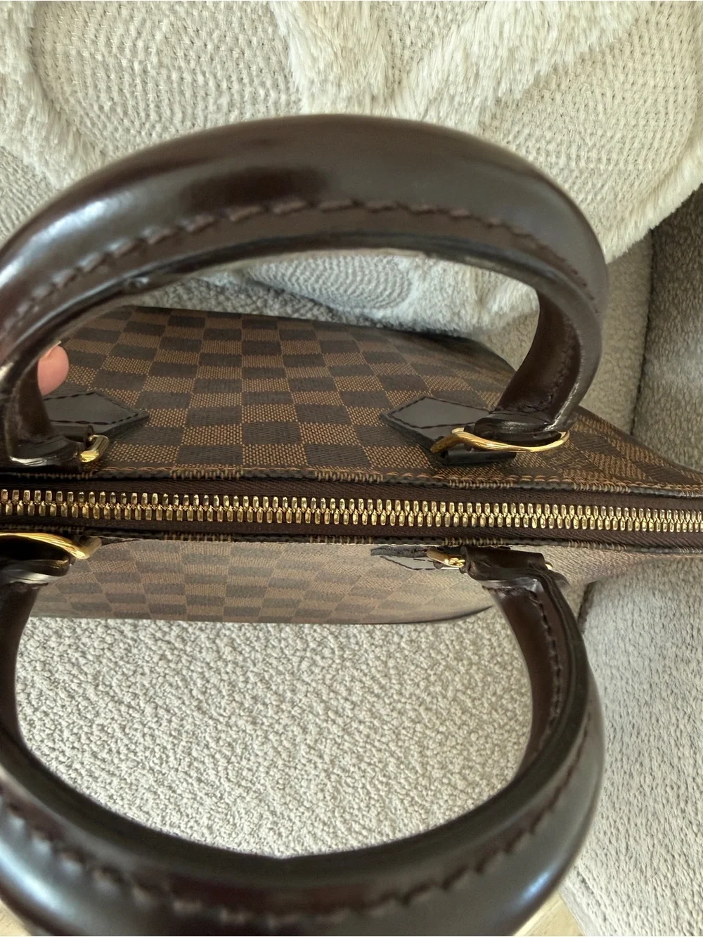 Louis Vuitton imperfections lock
